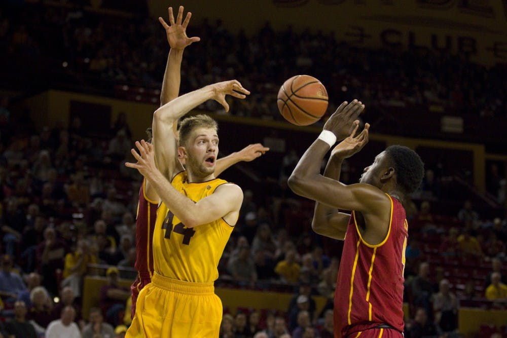 ASU junior guard Kodi Justice (44) completes a no-look pass during a men's basketball game against the University of Southern California Trojans in Wells Fargo Arena in Tempe, Arizona on Sunday, Feb. 26, 2017. ASU won 83-82.