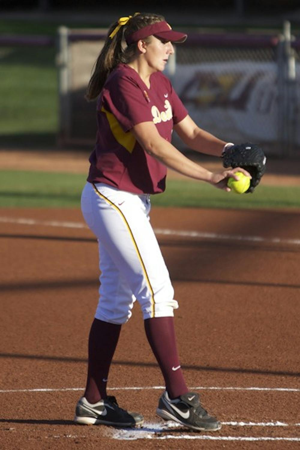 Top Spot: ASU junior pitcher Hillary Bach starts her pitching motion against Campbell on March 10 in Tempe. The Sun Devils recently jumped two spots in the rankings to become the top ranked team in the nation. (Photo by Scott Stuk)
