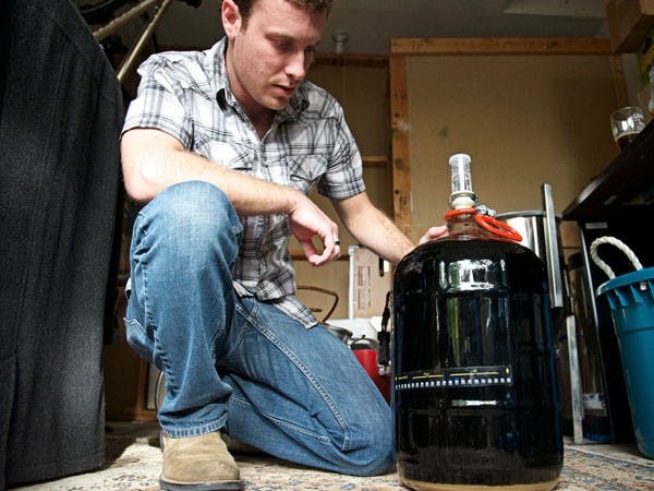 YOU BREW: Chemistry senior Nicholas Catanzaro recently founded the first and only home brewing club at ASU. The club's purpose is to get members to share beer and wine knowledge, recipes and having a good time with other enthusiasts. (Photo by Michael Arellano)