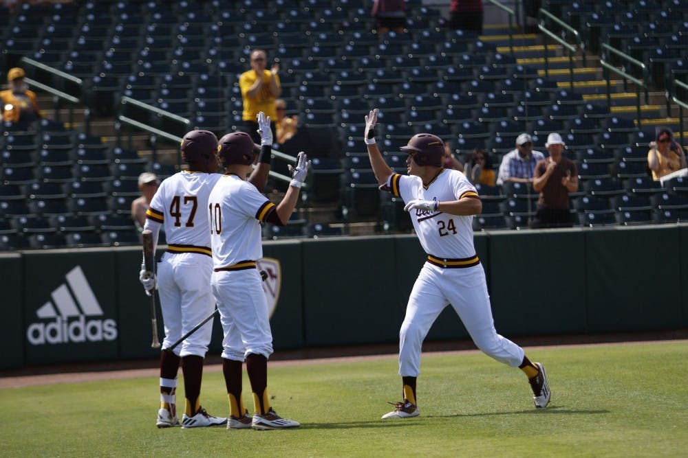ASU freshman outfielder Hunter Bishop celebrates with his teammates after hitting a home run in a baseball game versus CSU Bakersfield at the Phoenix Municipal Stadium in Tempe, Arizona on Sunday, April 23, 2017. The Sun Devils lost 8-6.