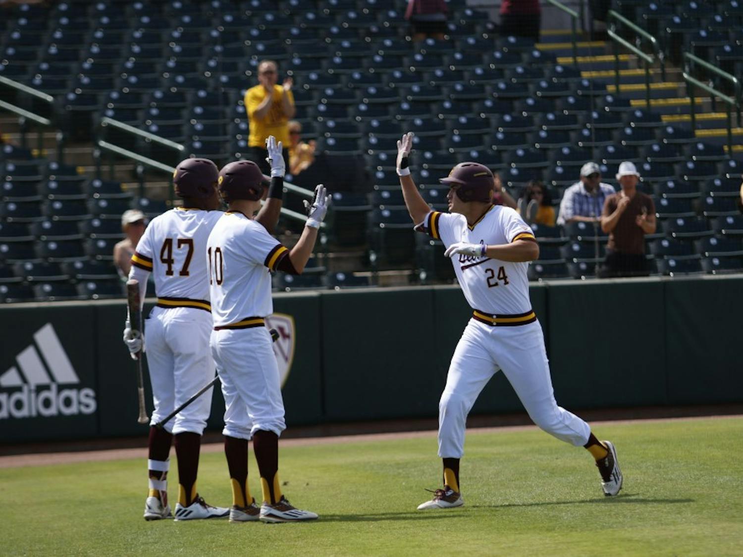 ASU freshman outfielder Hunter Bishop celebrates with his teammates after hitting a home run in a baseball game versus CSU Bakersfield at the Phoenix Municipal Stadium in Tempe, Arizona on Sunday, April 23, 2017. The Sun Devils lost 8-6.