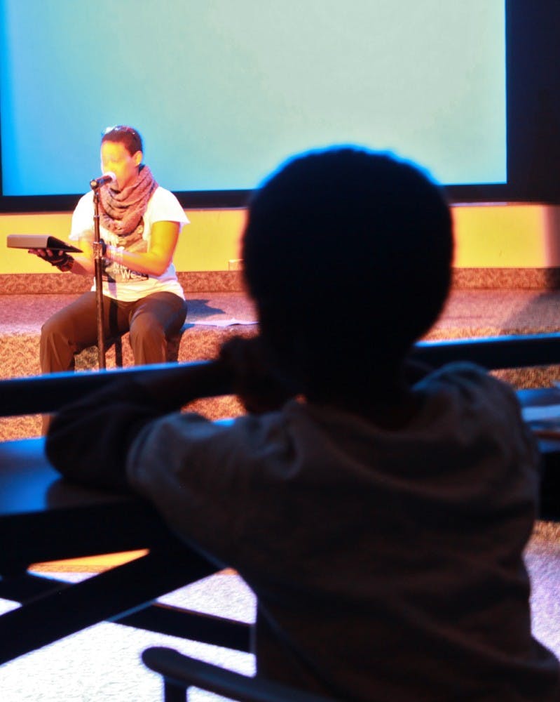 ASU Grad Student Marchlarina Davis reads during the MLK Poetry Jam. Photo by Nicole Gilbert.