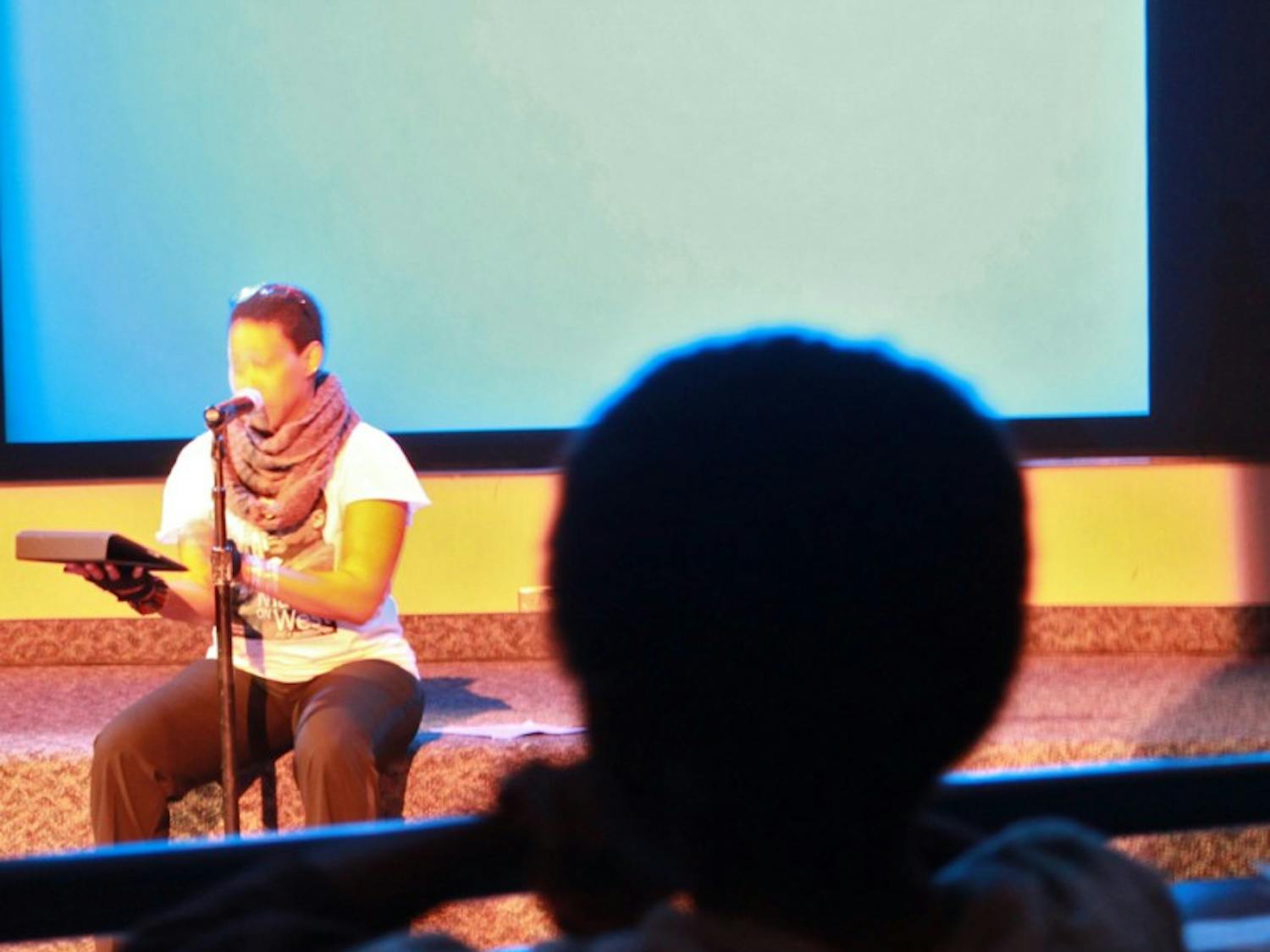 ASU Grad Student Marchlarina Davis reads during the MLK Poetry Jam. Photo by Nicole Gilbert.