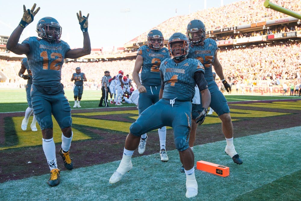 Sophomore running back Demario Richard (4) celebrates after scoring a rushing touchdown against UA on Saturday, Nov. 21, 2015, at Sun Devil Stadium in Tempe.