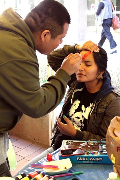 Health science freshmen Darius Bekis and Twila Skeet participate in the "Freak Out for Finals" event on the Downtown campus Monday afternoon. (Photo by Beth Easterbrook)