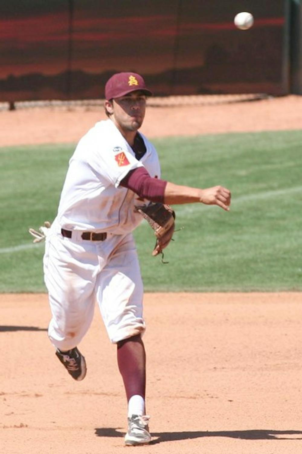 Spring cleaning: ASU junior third baseman Riccio Torrez makes a throw to first during the Sun Devils’ 8-0 victory over Oregon on Sunday. ASU swept the Ducks, giving up only three runs all weekend. (Photo  by Lisa Bartoli)