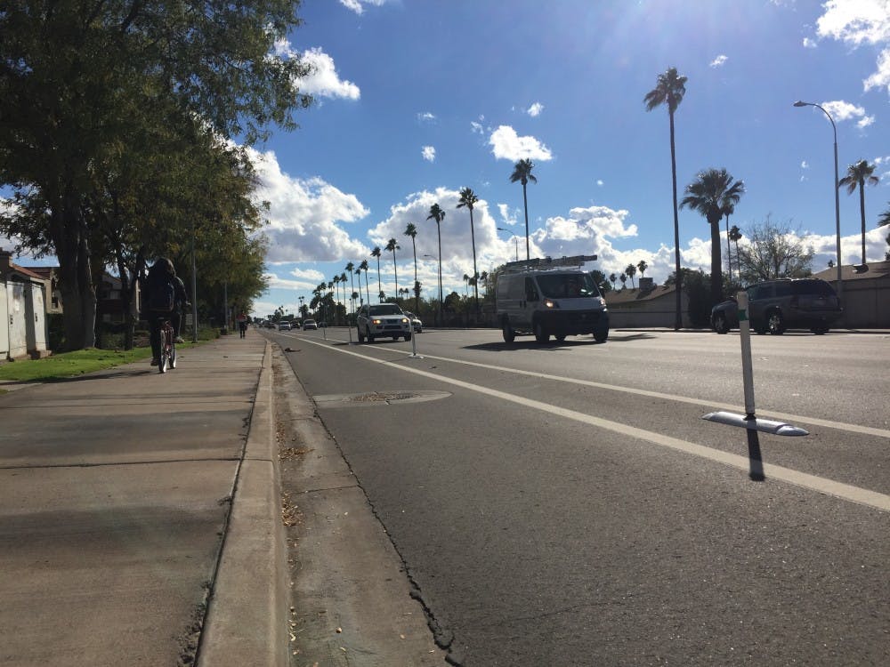 A segment of the bike lanes is pictured&nbsp;on McClintock Drive as a&nbsp;McClintock High School student uses the sidewalk to ride his bike in Tempe, Arizona.