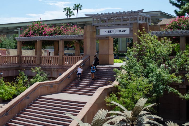 Students walk down the stairs toward Hayden Library on the Tempe campus on Friday, Sept. 6, 2019.