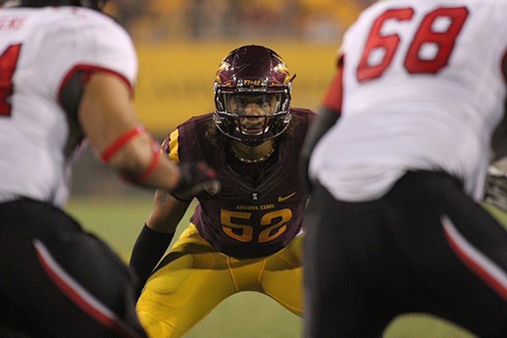 Redshirt junior defensive end Carl Bradford looks on as a play unfolds in Tempe at home. ASU's next matchup will be against Washington for the homecoming game this Saturday (Photo by State Press Staff)