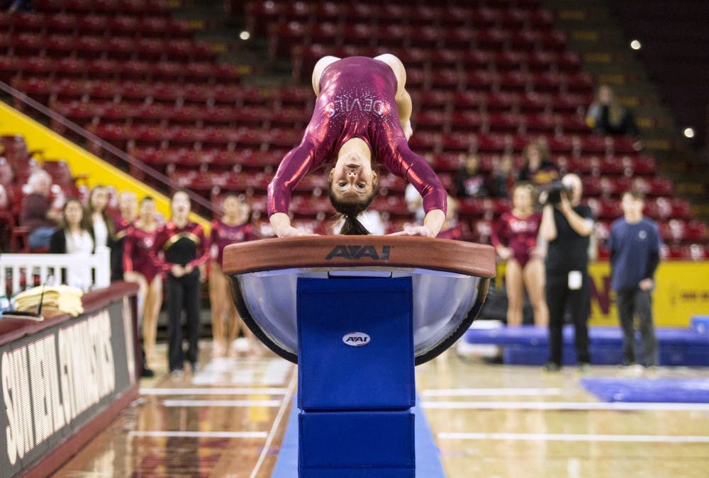 Taylor Allex performs her vault routine during a gymnastics meet against the University of Washington Huskies at Wells Fargo Arena in Tempe, Ariz., on Monday, Jan. 18, 2015. The Huskies posted a 194.650-192.450 victory over the Sun Devils.