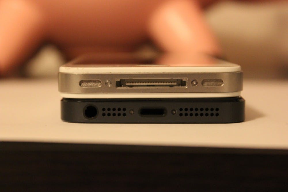 The iPhone 5 (bottom) has a different connector than its older sibling, the iPhone 45 (top). The iPhone 5’s headphone jack was also moved to the bottom of the phone. This photo gives a good representation of some of the physical changes that were made to the iPhone 5, like thickness and ports. Photo by Courtland Jeffrey.