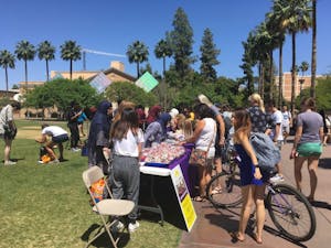 Refugees and Refugee Alliance club members sell a variety of Syrian pastries to students on the Hayden Lawn at ASU's Tempe campus&nbsp;on April 18, 2017 as part of their continual outreach to the refugee community.&nbsp;