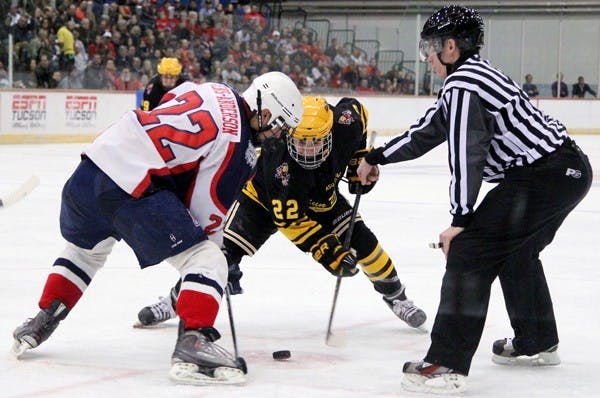 Center Kyle Bowen reaches out his stick to beat a UA skater on the faceoff on Feb. 23. It was one of the most successful seasons in history for the ASU club hockey team, but it did not accomplish its ultimate goal. (Photo by Ana Ramirez)