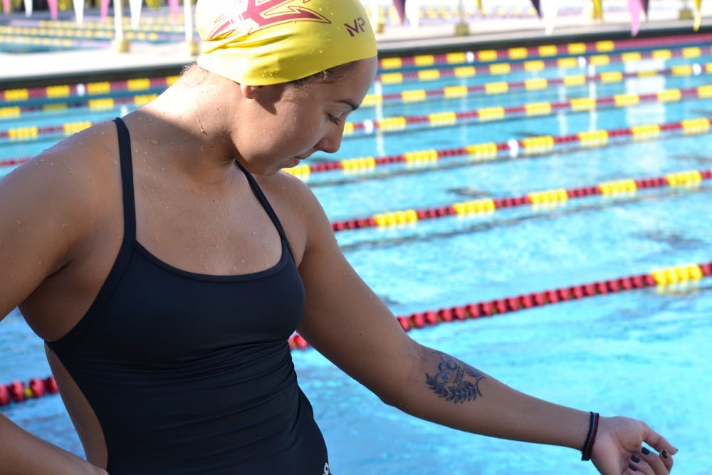ASU senior swimmer Katarina Simonovic shows off her new ink at the Mona Plummer Aquatic Complex on Aug. 27, 2016.