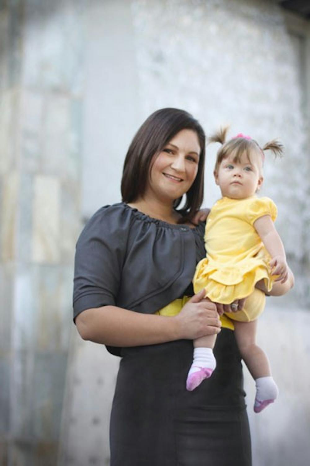 BABY THREADS: ASU senior Stephanie Lee, founder and owner of Bébé EcoPosh, holds her daughter Sophia, who helped inspire the eco-friendly baby product boutique. The e-boutique sells organic, eco-friendly clothes, toys and accessories. (Photo courtesy of Stephanie Lee)