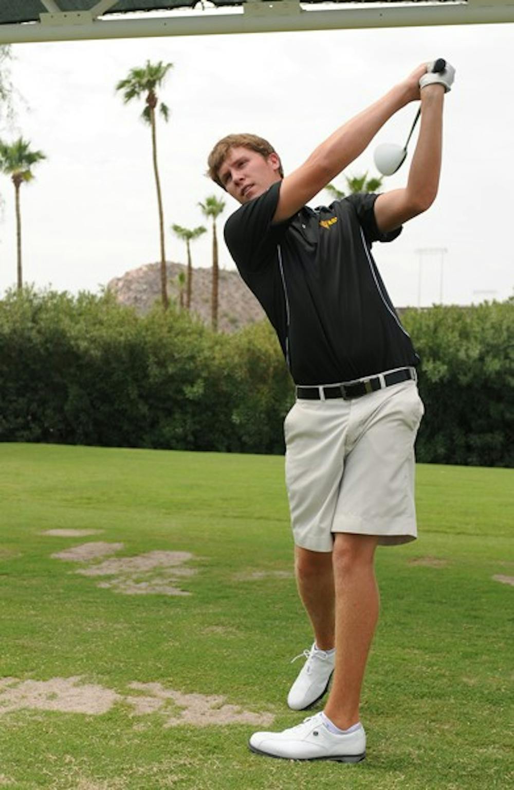 GETTING IT DONE: Senior Spencer Fletcher practices his wing during Media Day earlier this season. The ASU men’s golf team won the Cullum Invitational on Tuesday, with Fletcher tying for first. (Photo courtesy of Maggie Emmons)