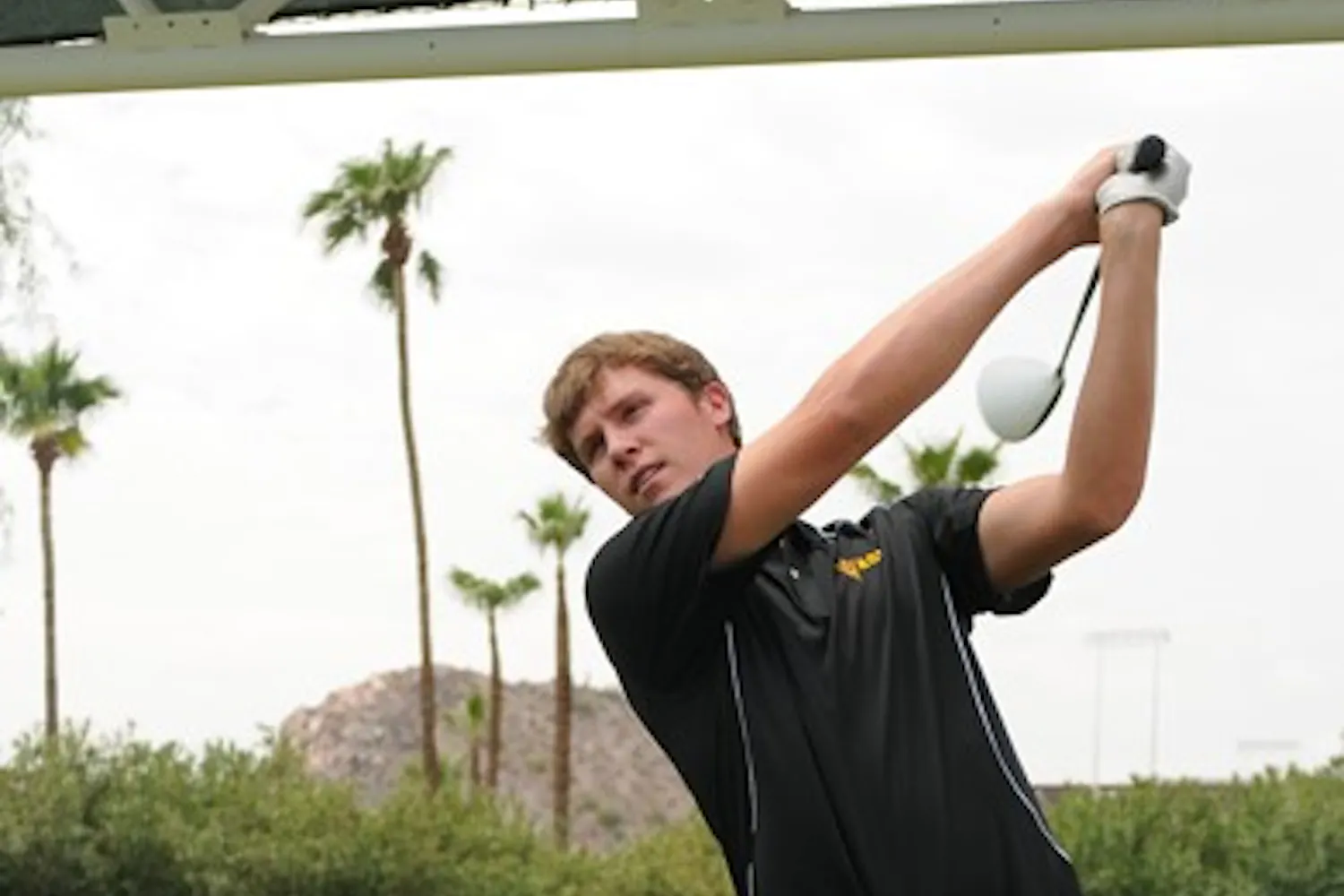 GETTING IT DONE: Senior Spencer Fletcher practices his wing during Media Day earlier this season. The ASU men’s golf team won the Cullum Invitational on Tuesday, with Fletcher tying for first. (Photo courtesy of Maggie Emmons)