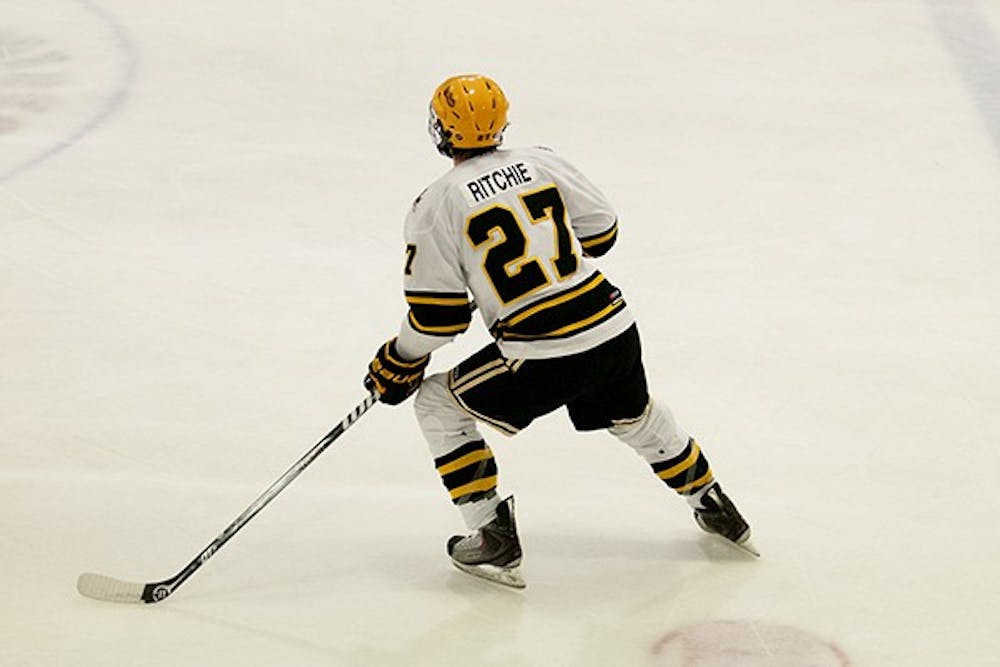 Sean Ritchie takes the ice at a home game in Tempe. This week, 9 players from the hockey team were suspended for a violation of team rules. (Photo by Molly J. Smith)