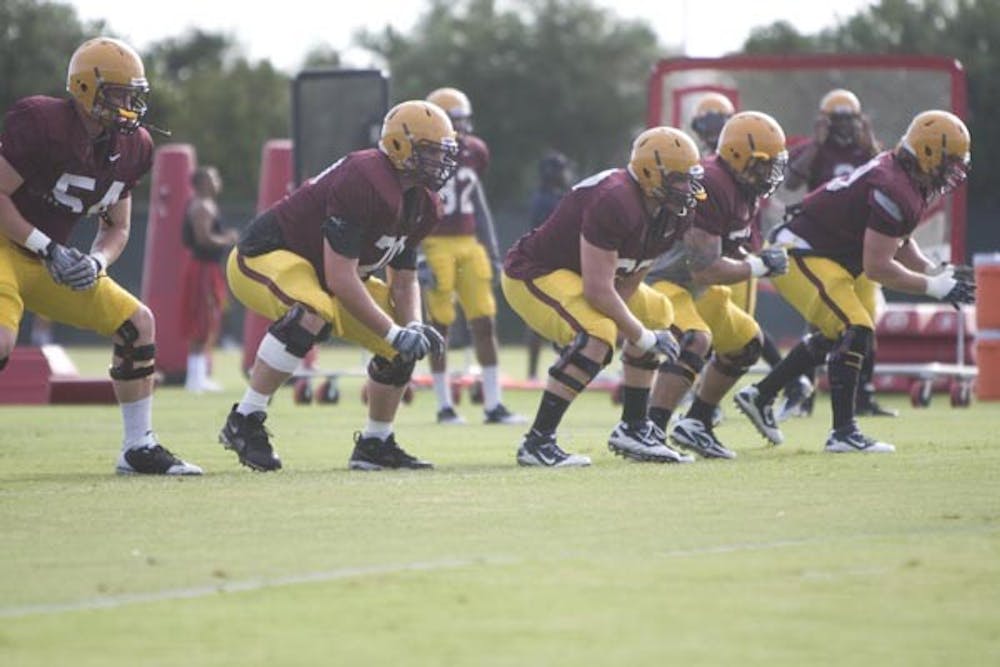 ON TWO: The ASU offensive lineman work during practice. The group lost two potential starters this preseason when the two decided to end their football careers due to injuries. (Photo by Scott Stuk)