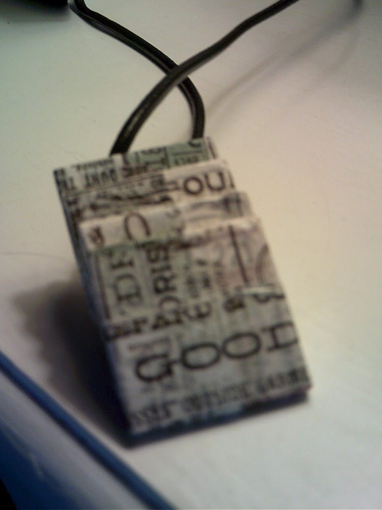 This wooden pendant will go perfect with any outfit. Photo by Faith Breisblatt. 