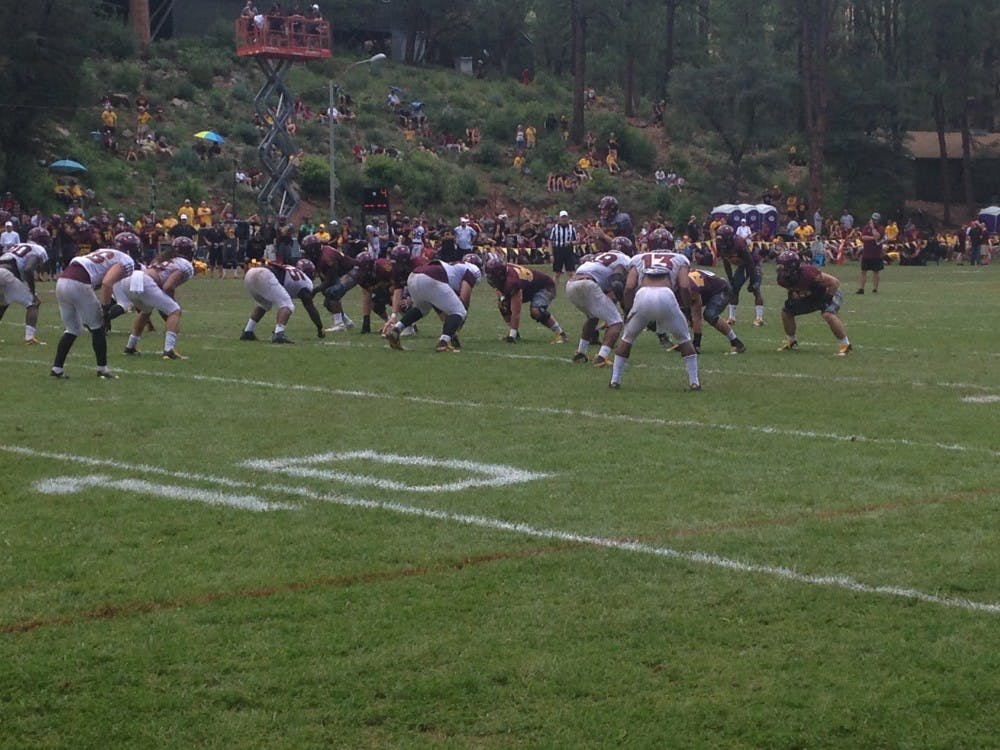 Redshirt sophomore quarterback Blake Barnett prepares to take a snap during ASU Football's scrimmage at Camp Tontozona in Payson, Arizona on Saturday August 5, 2017