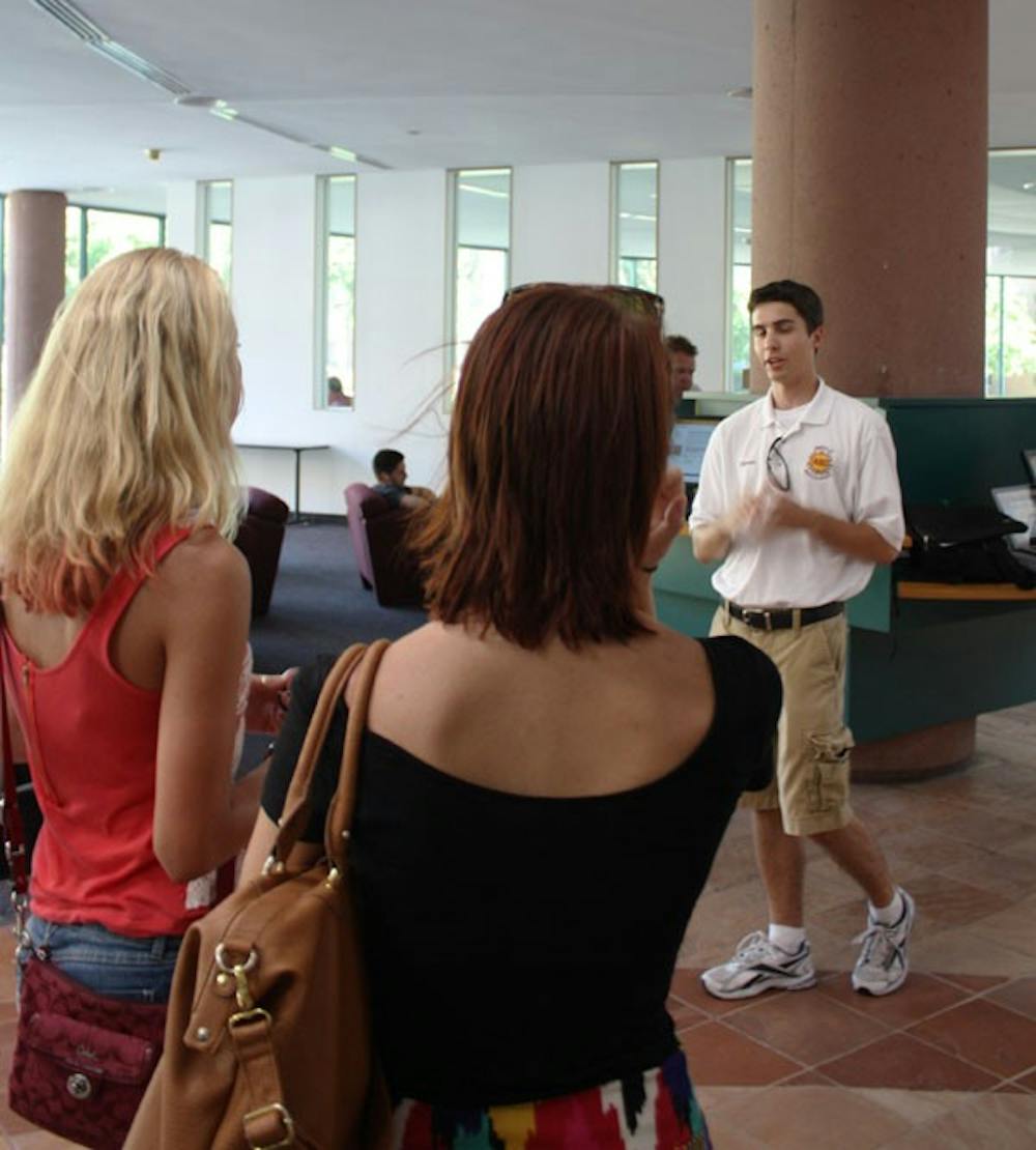 Steven Sifferman, member of Devils' Advocates, gives a tour to prospective students Wednesday on ASU Tempe campus.  (Photo by Cameron Tattle)