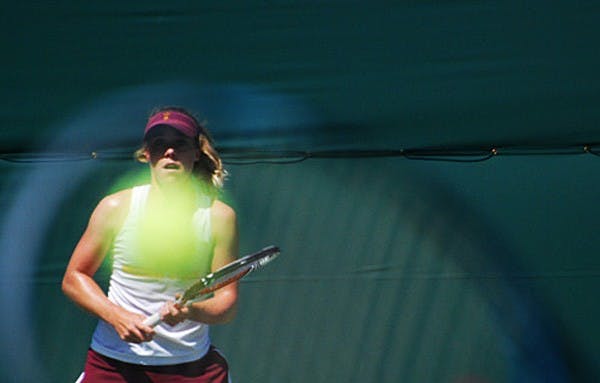 Senior Hannah James braces for a shot from a UCLA opponent on April 6. James and the ASU tennis team were shut out by USC on April 5. (Photo by Murphy Bannerman)