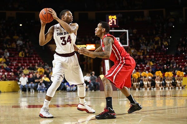 Senior guard Jermaine Marshall looks across the court to pass the ball during a home game against Bradley. (Photo by Arianna Grainey)