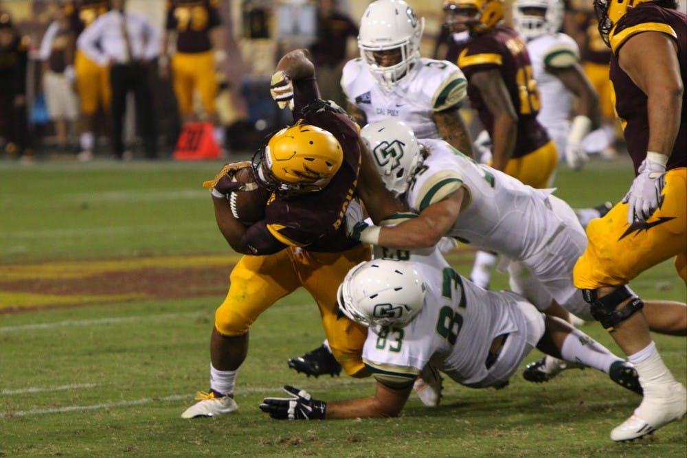 Sophomore running back Demario Richard fights for more yards in the third quarter against Cal Poly Saturday, Sept. 12, 2015 at Sun Devil Stadium  in Tempe. The Sun Devils defeated the Mustangs 35-21. 