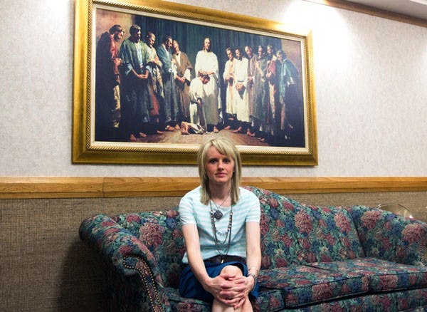 Brittney Phelps, who graduated in 2012, sits in the waiting room at her local Mormon Ward. Her particular Ward focuses on upholding the 10 commandments as well as building strong families. (Photo by Dominic Valente)