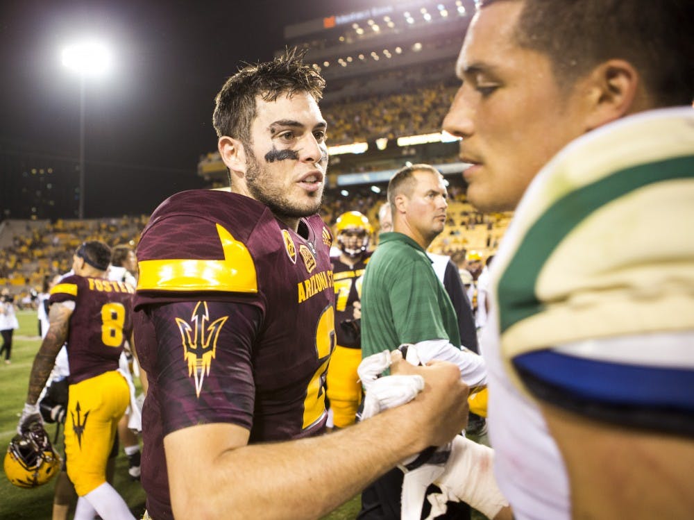 Sun Devil quarterback Mike Bercovici, left, greets Mustang players after a game against visiting Cal Poly at Sun Devil Stadium in Tempe on Saturday, Sept. 12, 2015. ASU beat Cal Poly 35-21 in their season opener. 