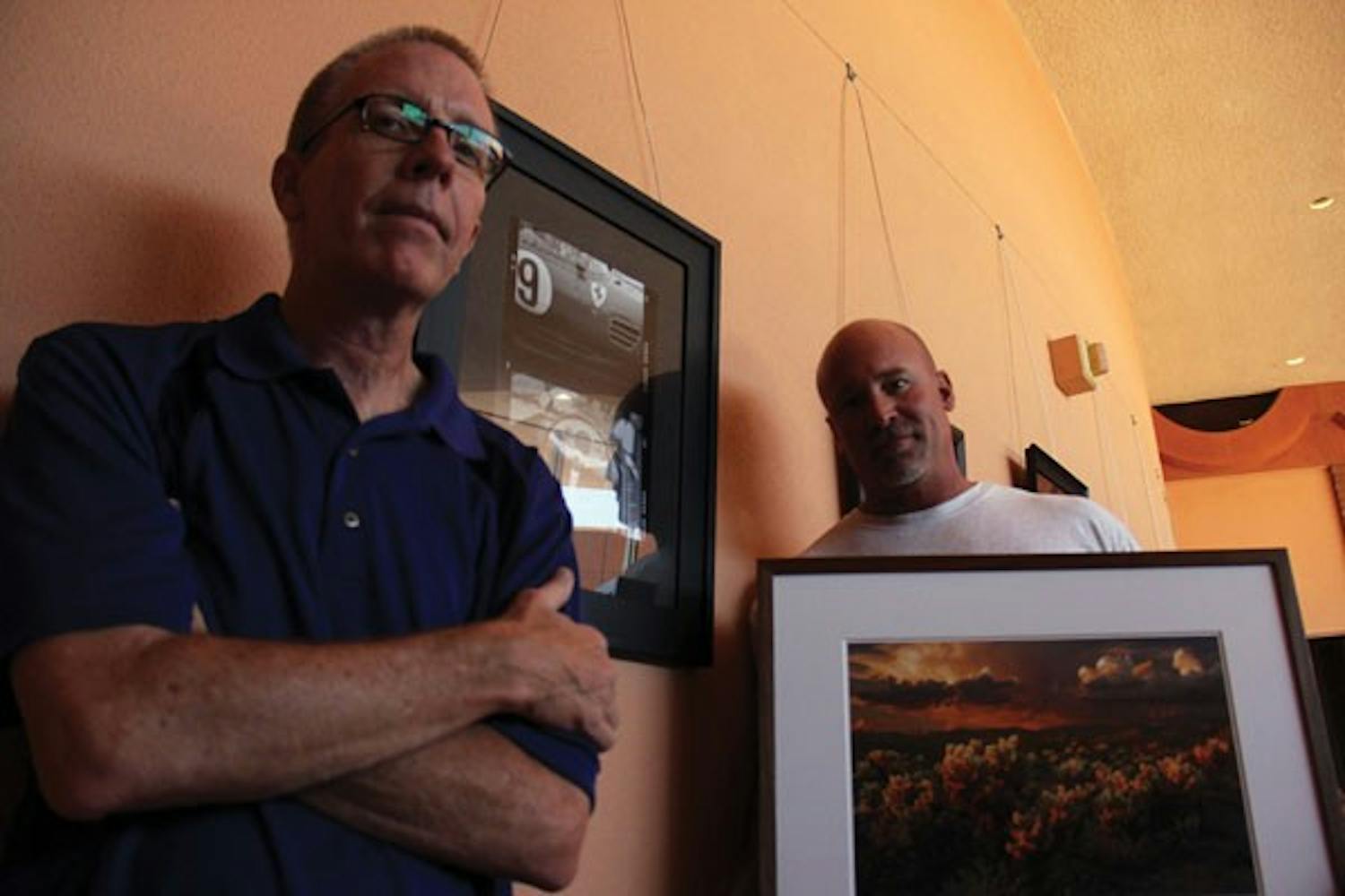Left to right: Rhet Andrews and Mark Capurso are sharing exhibition space for the month of June at the ASU Gammage to display their photography of the Southwest and Europe. (Photo by Shawn Raymundo)