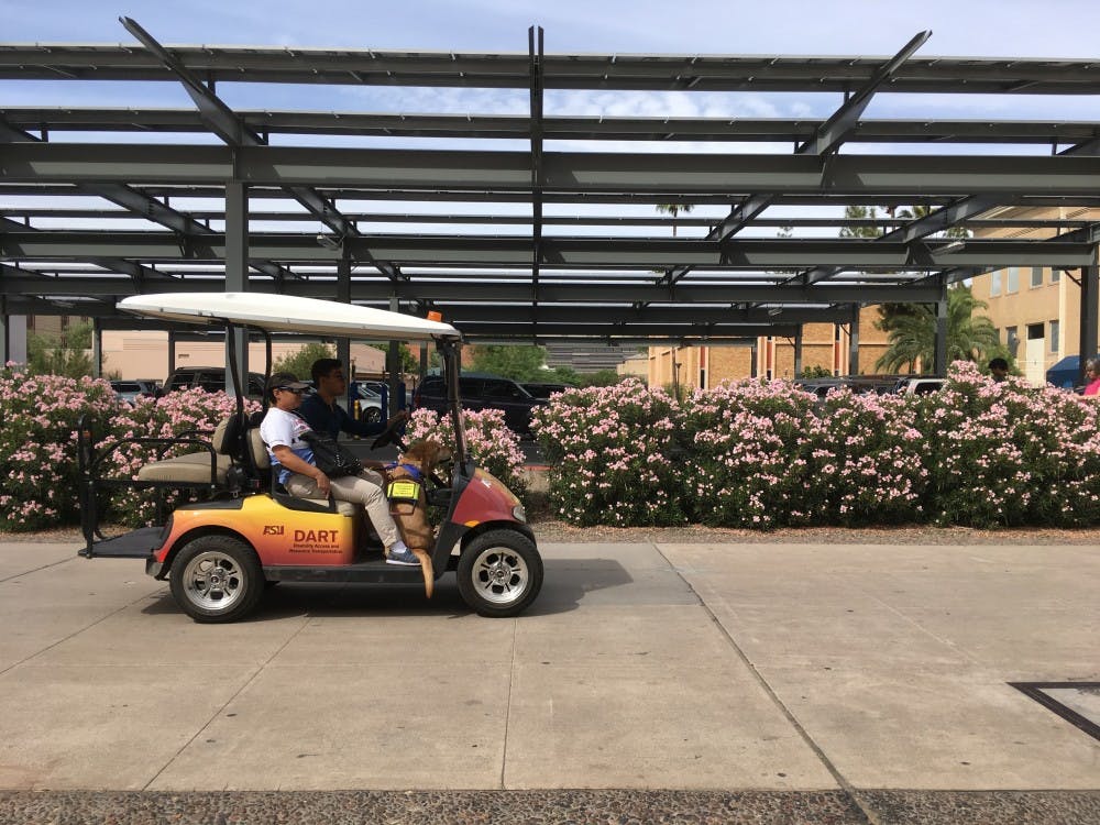A student and her service dog are transported to the Disability Resource Center on a shuttle on Monday, Sept. 19, 2016.&nbsp;