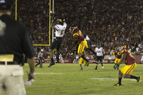Redshirt junior wide receiver Jaelen Strong drops a pass from redshirt junior quarterback Mike Bercovici in a game against USC on Oct. 4, 2014. ASU won against USC 38-34. (Photo by Alexis Macklin)