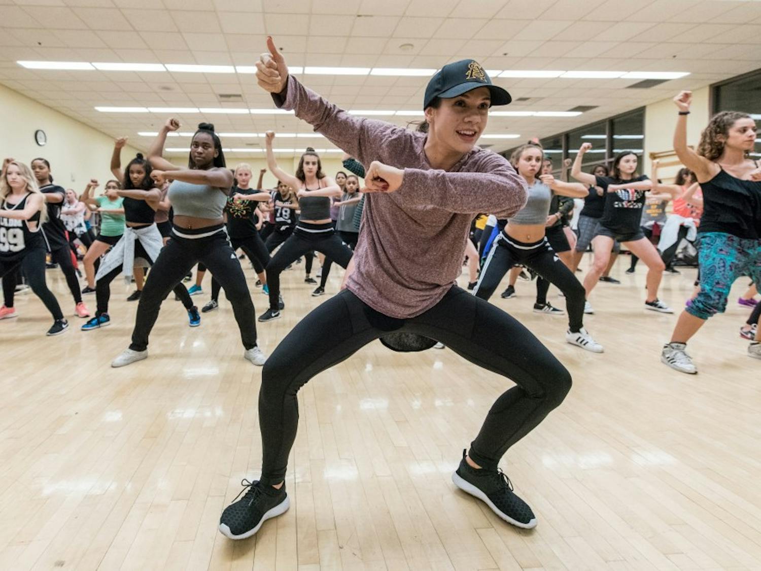 Brittany Hannish, a 2013 ASU graduate, teaches choreography to the Hip-Hop Coalition class being held in the Tempe Sun Devil Fitness Center on Tuesday Aug. 23, 2016. According to their club description, the Hip-Hop Coalition is a club with all levels of talent, which promotes all styles of hip-hop through freestyling and choreography.