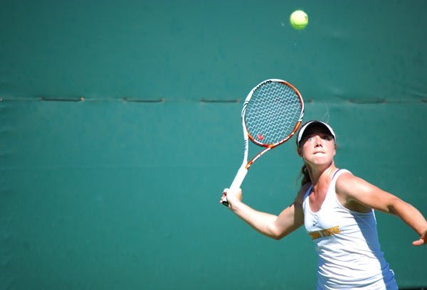 Senior Hannah James whips the racket back to return a shot against Saint Mary's on March 3. James’s victory captured the match for the Sun Devils against Saint Mary's. (Photo by Murphy Bannerman)