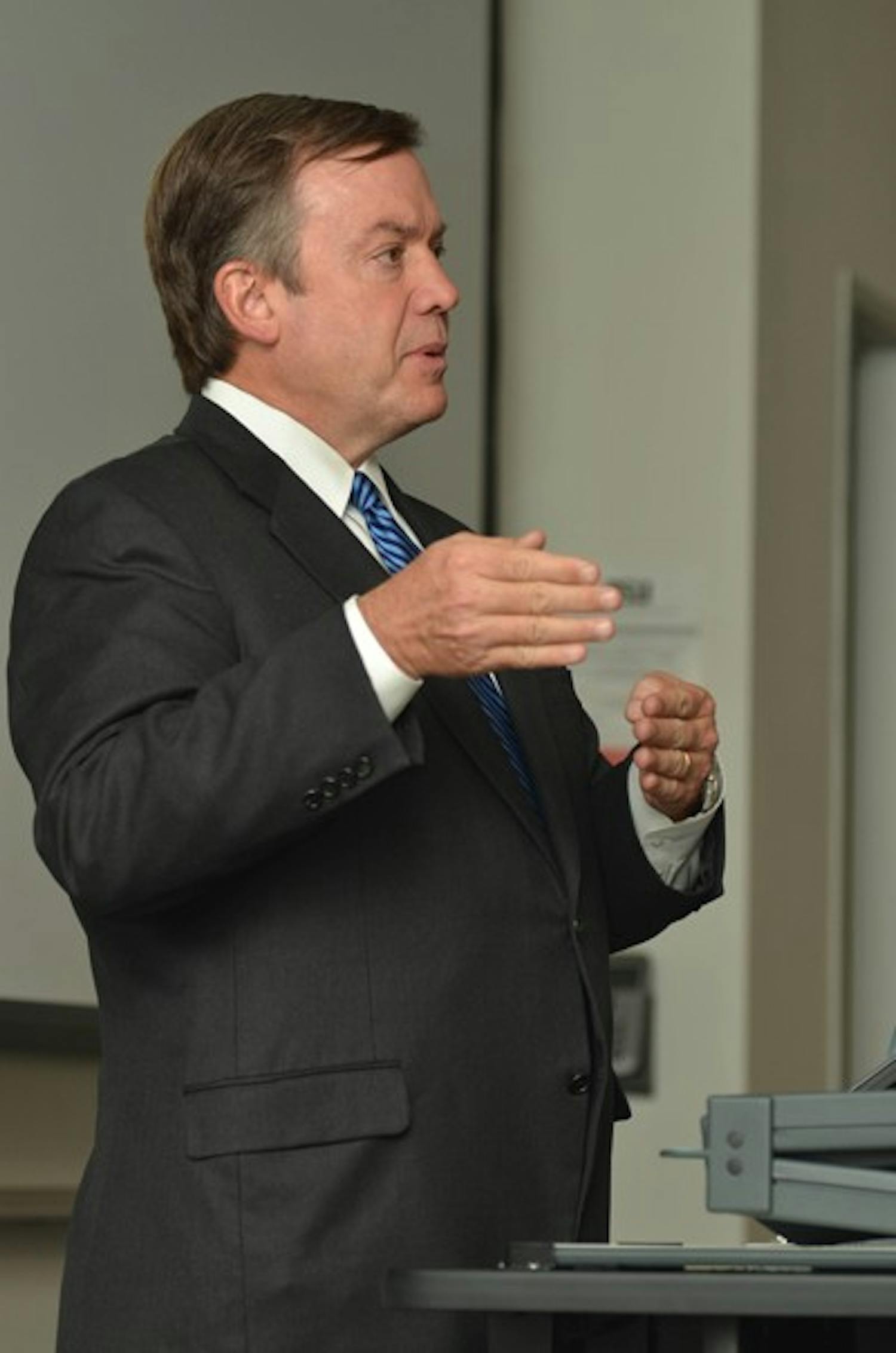INTELLECTUAL ELITE: ASU President Michael Crow speaks to students on all campuses through a video broadcast last semester.  Crow was recently selected as one of the top 25 thinkers by Slate Magazine. (Photo by Aaron Lavinsky)