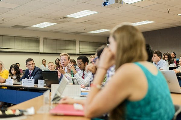 USG Sen. Daniel Martin (left, gesturing) speaks during a floor debate on the impeachment of Sen. Isabelle Murray, Tuesday, Oct. 21. Sen. Murray was impeached for breaking guidelines on speaking to media and for communication issues. (Photo by Ben Moffat)