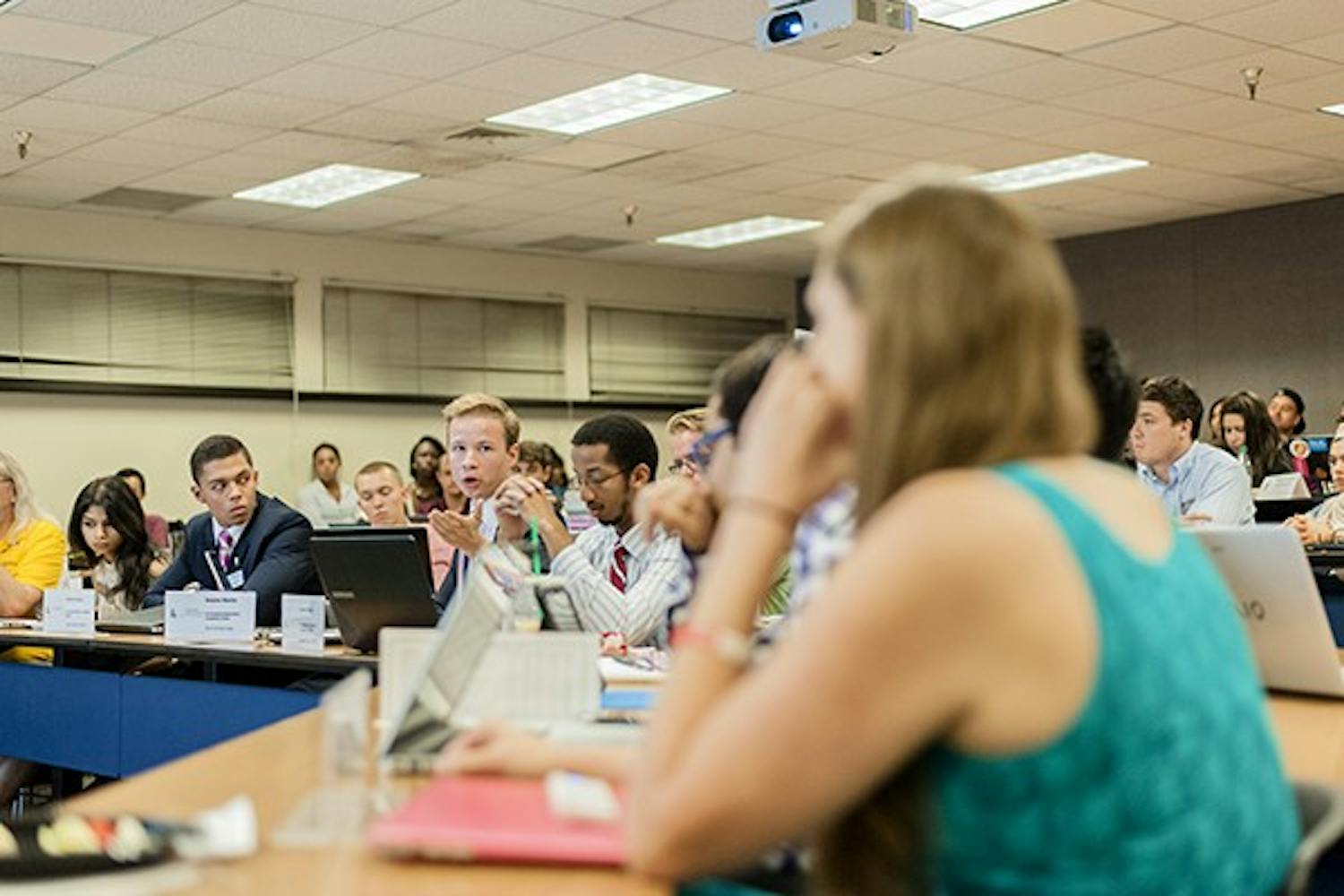 USG Sen. Daniel Martin (left, gesturing) speaks during a floor debate on the impeachment of Sen. Isabelle Murray, Tuesday, Oct. 21. Sen. Murray was impeached for breaking guidelines on speaking to media and for communication issues. (Photo by Ben Moffat)