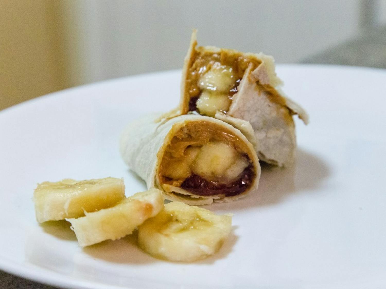 The banana burrito is a cheap and easy-to-make snack made of four main ingredients: bananas, jam, peanut butter and a tortilla. You can also add Nutella or strawberries to make the burrito even better. (Daniel Kwon/The State Press)