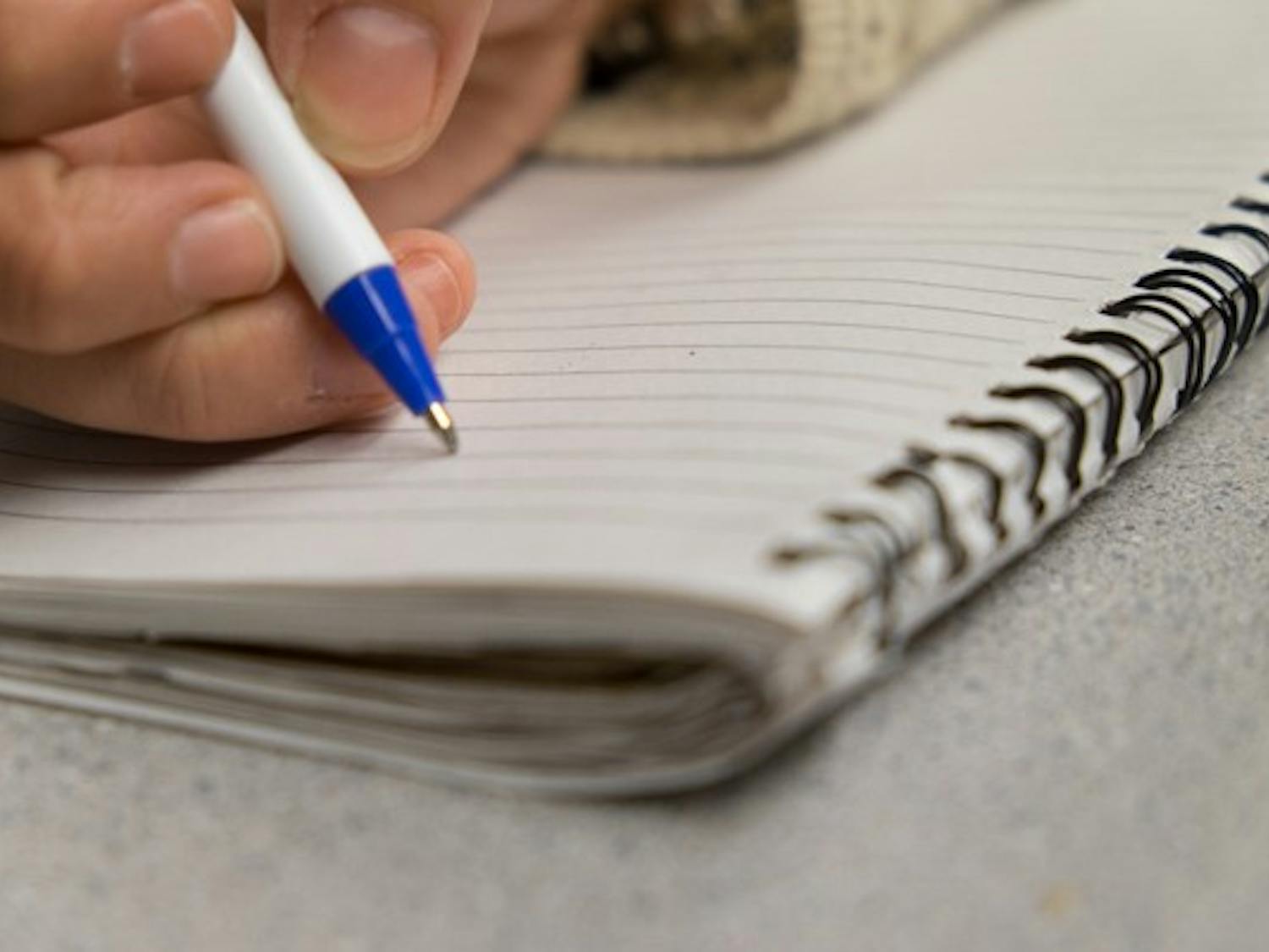 Numerous ASU professors are encouraging students to take handwritten notes in lieu of electronic notes. A study showed that students who write notes by hand do better on exams. (Photo illustration by Andrew Ybanez)
