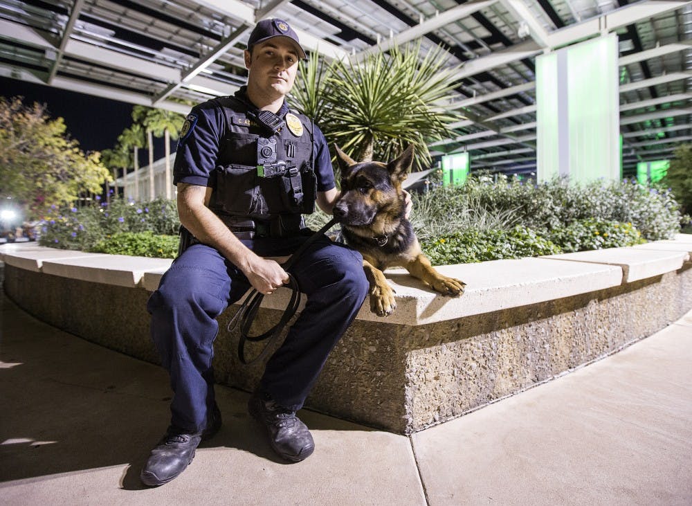 ASU police officer Colton Adams and his K-9 partner Tillman are photographed near the Memorial Union building on Friday, Nov. 18, 2016. 