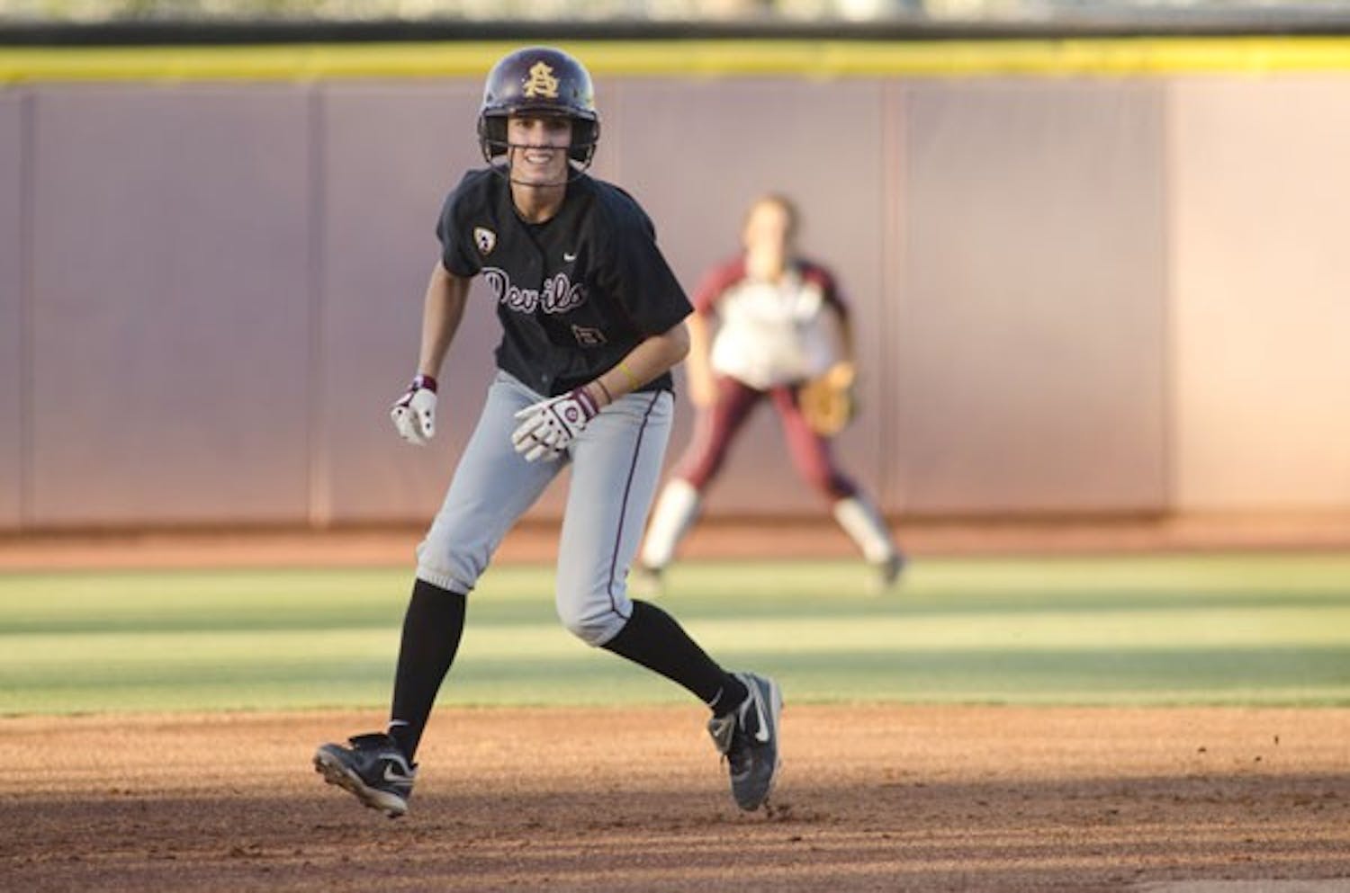 Complete season: ASU senior outfielder Lesley Rogers looks to steal third during the Sun Devils’ 4-2 win over Texas A&M on May 27. Senior leadership was just one of the many factors that led to ASU’s dominance this year.  (Photo by Aaron Lavinsky)