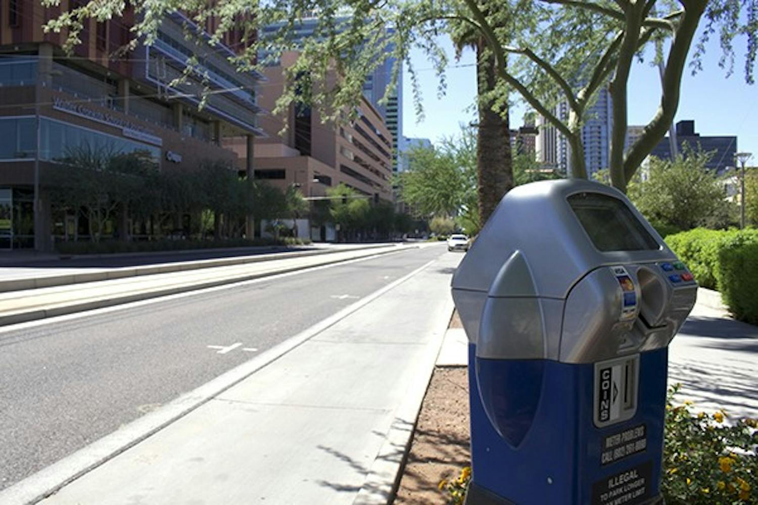 Phoenix will implement demand-based parking meter pricing. Smart-meters, which accept credit cards and coins, will be installed in designated parking zones across the city by the end of 2014. (Photo by Andrew Nicla)