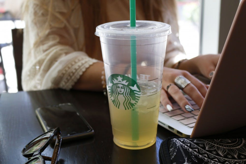 A customer enjoys a tea and works on her laptop at the Starbucks on ASU’s downtown campus in Phoenix, Arizona pictured on Saturday, April 1, 2017. 