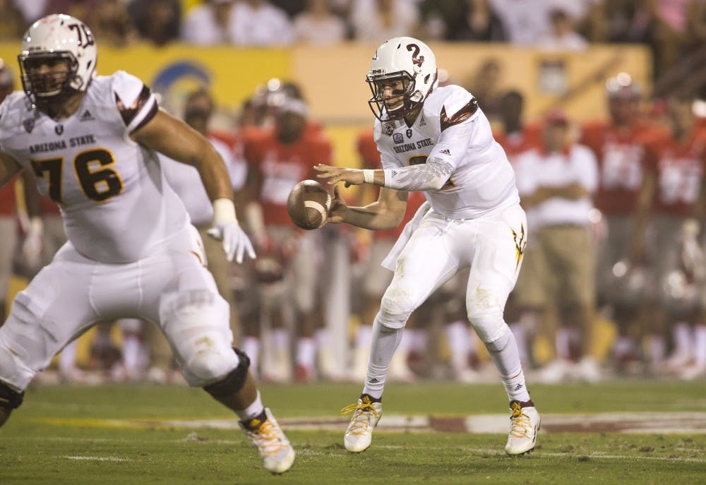 Redshirt senior quarterback Mike Bercovici takes a snap against New Mexico on Friday, Sept. 18, 2015, at Sun Devil Stadium in Tempe.