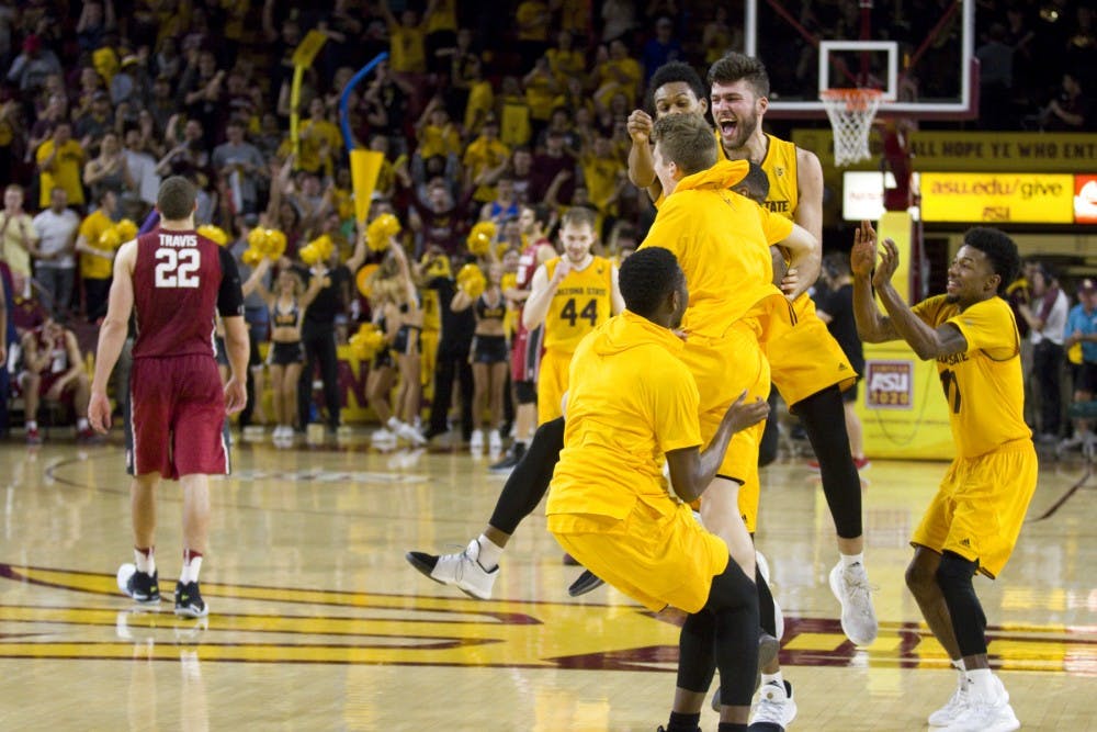 The ASU men's basketball team celebrates after defeating the University of Stanford in a men's basketball game in Wells Fargo Arena in Tempe, Arizona on Saturday, Feb. 11, 2017. ASU won 75-69. (Josh Orcutt/State Press)