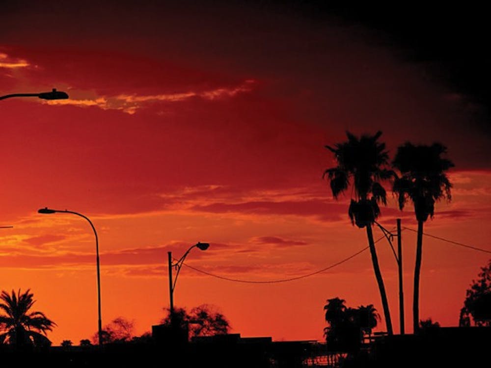 As the sun sets, the orange rays creates a silhouette on Tempe's concrete jungle. (Photo by Anand Aravamudhan)