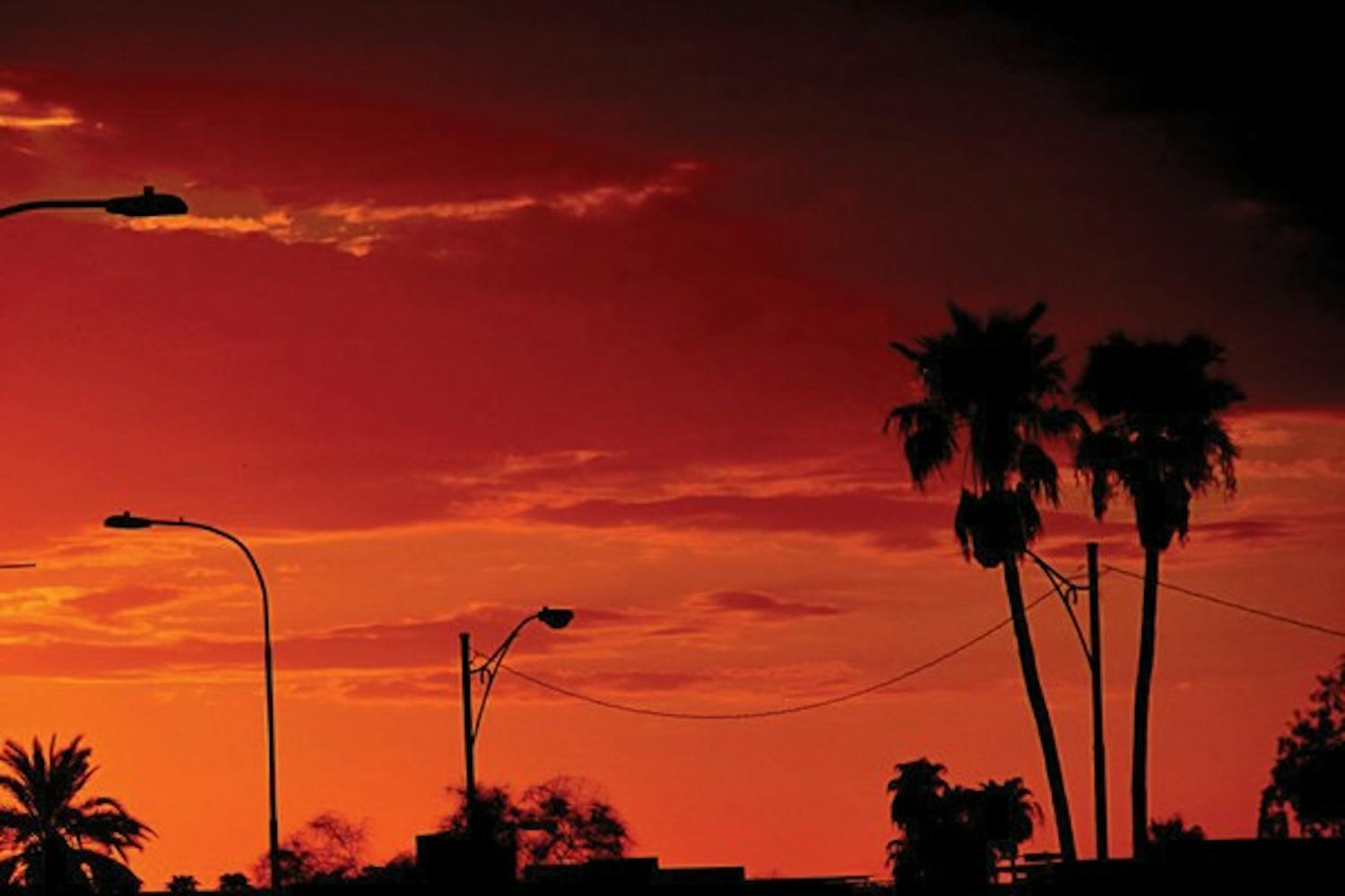 As the sun sets, the orange rays creates a silhouette on Tempe's concrete jungle. (Photo by Anand Aravamudhan)
