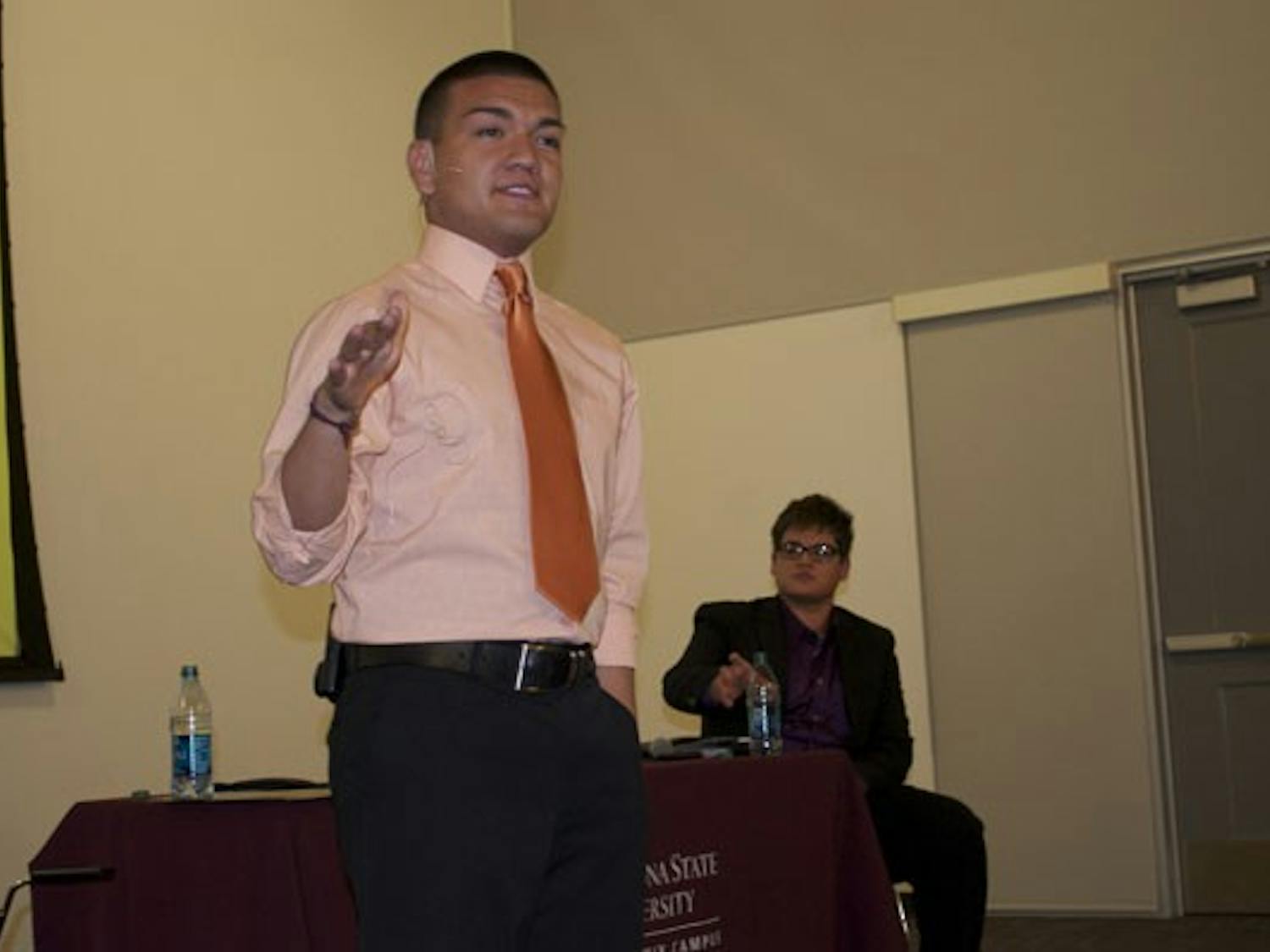STUDENT DEBATE: Freshman Andres Cano introduces himself Tuesday at the ASASUD debate for the downtown presidential position, as his opponent junior Christian Vasquez looks on. (Photo by Molly Smith)